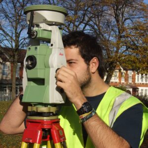 Founder of Geo Scan performing a measured survey on-site with surveying equipment signifying 25 years of experience